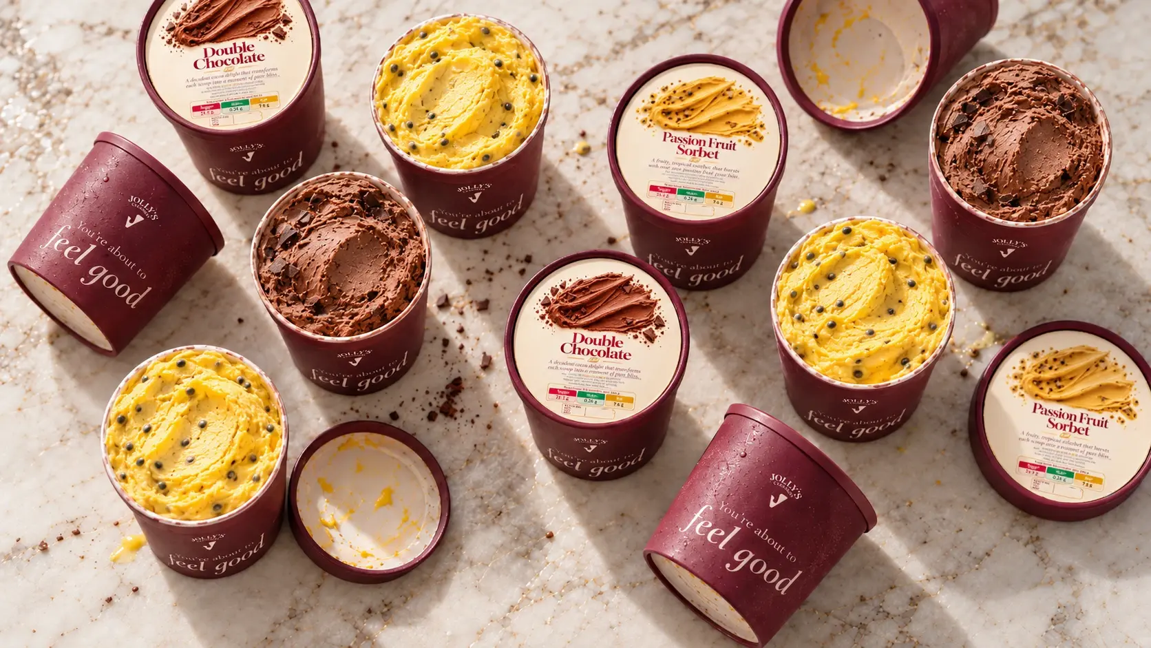 Jolly's 500 ml tubs of Double Chocolate and Passion Fruit Sorbet, lids off, on a marble counter